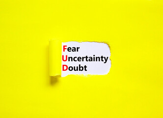 FUD fear uncertainty doubt symbol. Concept words FUD fear uncertainty doubt on white paper on a beautiful yellow background. Business and FUD fear uncertainty doubt concept. Copy space.