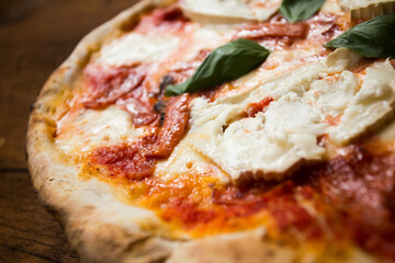 Bufala Mozzarella Pizza. Neapolitan pizza made with tomato sauce, mozzarella cheese and some vegetables. Italian recipe.
