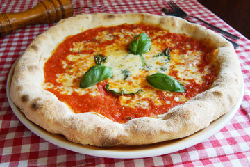 Margherita Pizza. Neapolitan pizza made with San Marzano tomatoes, mozzarella cheese, fresh basil, salt and extra virgin olive oil.
