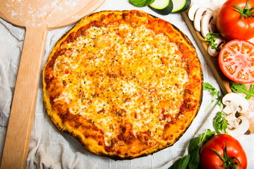 Margherita Pizza. Neapolitan pizza made with San Marzano tomatoes, mozzarella cheese, fresh basil, salt and extra virgin olive oil.
