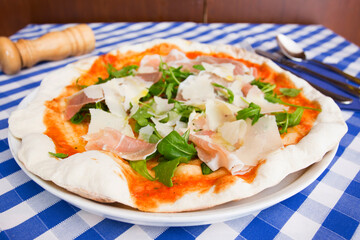 Prosciutto Pizza. Neapolitan pizza with tomato sauce, cheese and prosciutto ham. Authentic Italian recipe.