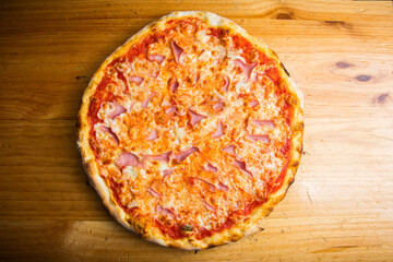 Prosciutto Pizza. Neapolitan pizza with tomato sauce, cheese and prosciutto ham. Authentic Italian recipe.