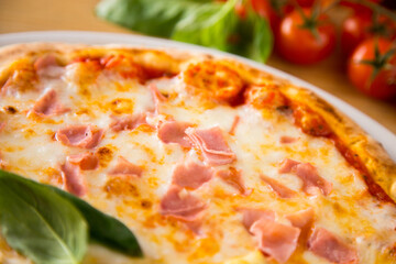 Prosciutto Pizza. Neapolitan pizza with tomato sauce, cheese and prosciutto ham. Authentic Italian recipe.