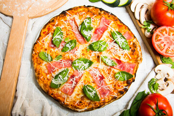 Prosciutto Pizza. Neapolitan pizza with tomato sauce, cheese and prosciutto ham. Authentic Italian recipe.