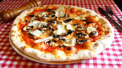 Mushroom Pizza. Neapolitan pizza with tomato sauce, cheese, ham and mushrooms. Authentic Italian recipe.