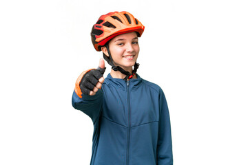 Teenager cyclist girl over isolated chroma key background with thumbs up because something good has happened