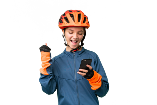 Teenager cyclist girl over isolated chroma key background with phone in victory position