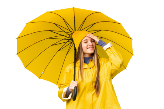 Teenager girl with rainproof coat and umbrella over isolated chroma key background smiling a lot - Powered by Adobe