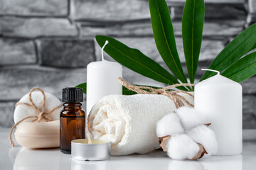 Spa and wellness accessories on gray stone background. Concept of face and body care.