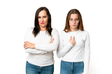 mother and daughter over isolated chroma key background annoyed angry in furious gesture