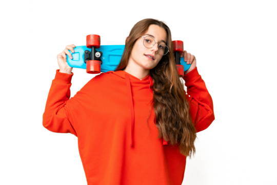 Teenager girl over isolated chroma key background with a skate with happy expression