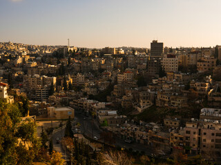Fototapeta na wymiar Amman, downtown view from jabal Amman, sunset and gray sky, dec 2022