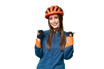 Young cyclist woman over isolated chroma key background with thumbs up gesture and smiling