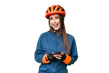 Young cyclist woman over isolated chroma key background surprised and sending a message - obrazy, fototapety, plakaty