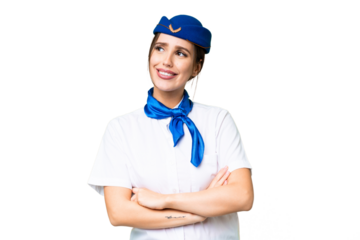 Airplane stewardess over isolated chroma key background looking up while smiling