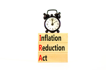 IRA inflation reduction act symbol. Concept words IRA inflation reduction act on wooden blocks on a beautiful white table white background. Business IRA inflation reduction act concept. Copy space.