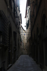 Fototapeta na wymiar An old narrow street in Genova, Italy