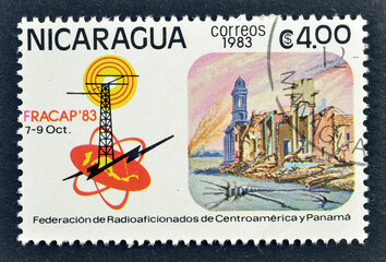 Cancelled postage stamp printed by Nicaragua, that shows Radio tower and Congress emblem,  circa...