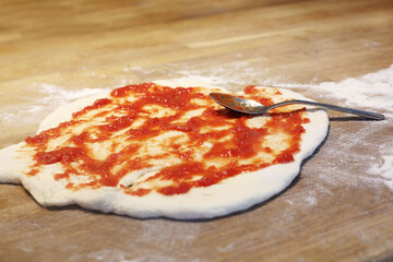 cooking homemade pizzza