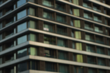 Obraz premium Blur modern urban apartment building exterior in evening.