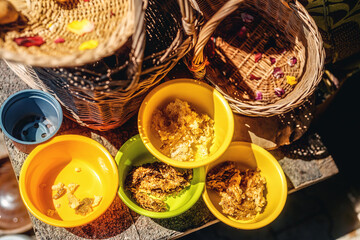 propolis in plastic bowls, honeycomb for breakfast.