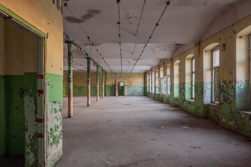 Old abandoned haunted red brick factory of stockings, pantyhose and socks in Central Europe, Poland