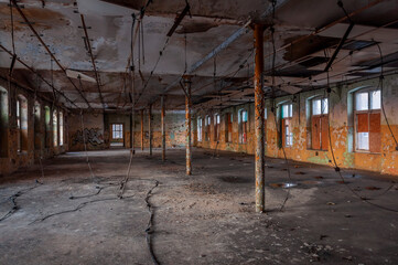 Old abandoned haunted red brick factory of stockings, pantyhose and socks in Central Europe, Poland