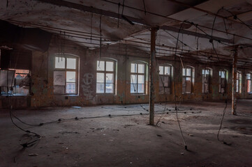 Old abandoned haunted red brick factory of stockings, pantyhose and socks in Central Europe, Poland