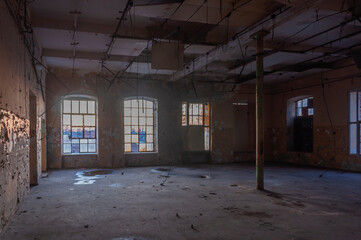 Old abandoned haunted red brick factory of stockings, pantyhose and socks in Central Europe, Poland