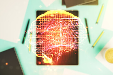 Creative artificial Intelligence concept with human brain sketch and modern digital tablet on...