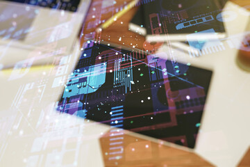 Double exposure of abstract programming language hologram and digital tablet on background, top view, research and development concept