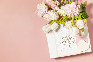 Happy Valentine's Day greeting card, gift box and beautiful spring flowers on light pink background. Valentine's day, Womans day, mothers day greeting card. View from above. Copy space.