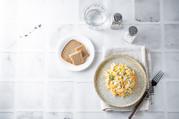 Coleslaw, cabbage cucumber corn carrot salad with greek yogurt dressing in a bowl