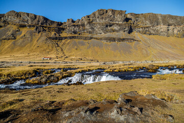 Waterfall and landscape under Lake Torutjorn, Iceland
