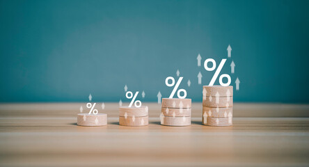 Interest rate financial and mortgage rates concept. Wooden block increasing on top with percentage symbol and arrow upward direction. Return on stocks and mutual funds from business growth concept. - obrazy, fototapety, plakaty