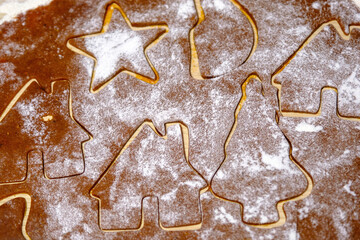 Rolled dough for making cookies cut into molds.