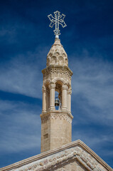Fototapeta na wymiar church tower with sky and clouds