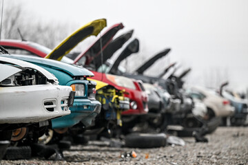 junk cars at auto salvage yard in the city,