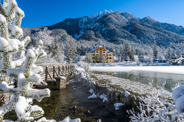 A sunny winter morning ata snowy and iced Lake Dobbiaco, Province of Bolzano, Trentino Alto Adige,...