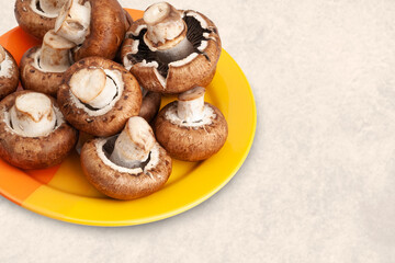 Mushrooms on a plate. Mushrooms in a plate on a marble