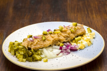 roasted herring on a base of vegetables