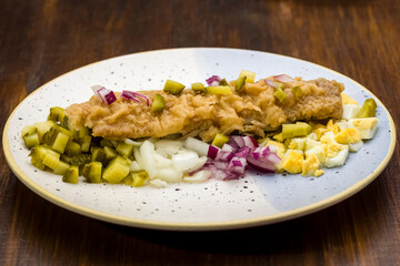 roasted herring on a base of vegetables