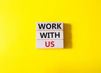 Work with us symbol. Wooden blocks with words Work with us. Beautiful yellow background. Business and Work with us concept. Copy space.