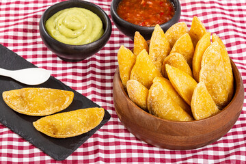 Colombian Empanada With Spicy Sauce And Guacamole.