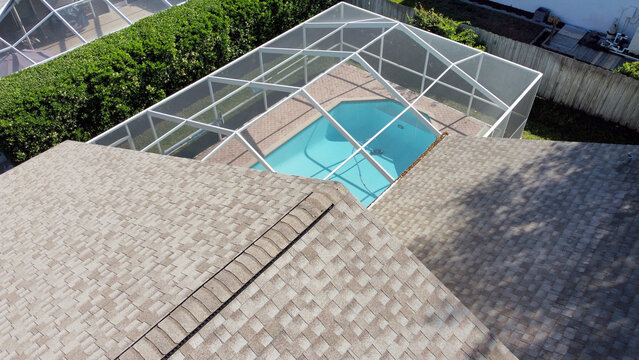 Aerial Drone Photo of House Pool with screen enclosure and Roof Tampa Florida	
