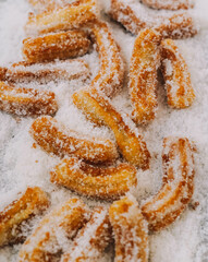 Churros fritos con azucar tipicos de españa