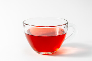 Glass cup with tea on a white background isolated.