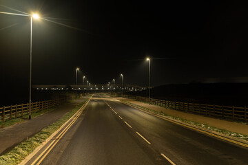 Fototapeta na wymiar Illuminated road at night
