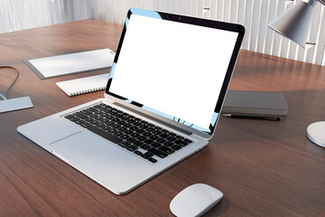 Fototapeta premium Perspective view on blank white modern laptop monitor with place for your logo or text on brown table with notebooks and lamp on light metallic decorated wall background. 3D rendering, mockup