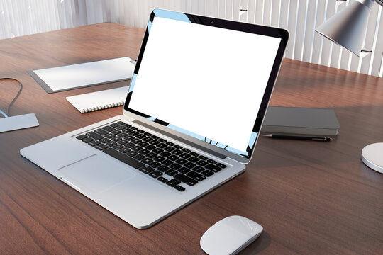 Perspective view on blank white modern laptop monitor with place for your logo or text on brown table with notebooks and lamp on light metallic decorated wall background. 3D rendering, mockup